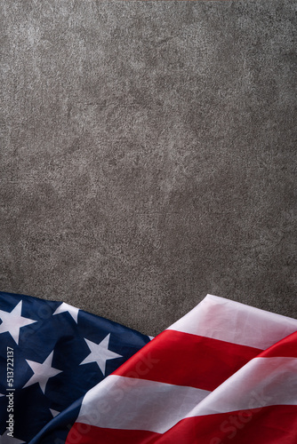 Concept of Independence day or Memorial day. Flag over dark gray table background.