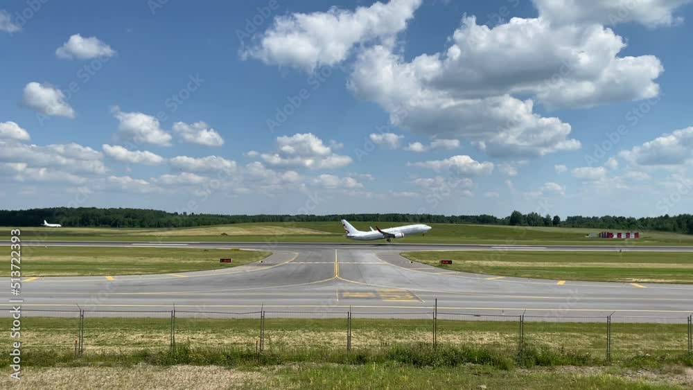 Airplane taking off in Vilnius airport on summer day Airplane taking off in Vilnius airport on summer day