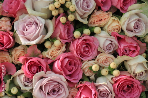 Pink and purple roses in a wedding centerpiece