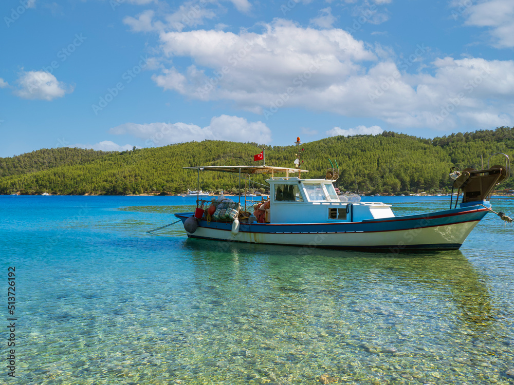 Boat on the sea. A fishing boat at sea in Akbük bay in Muğla province of Turkey