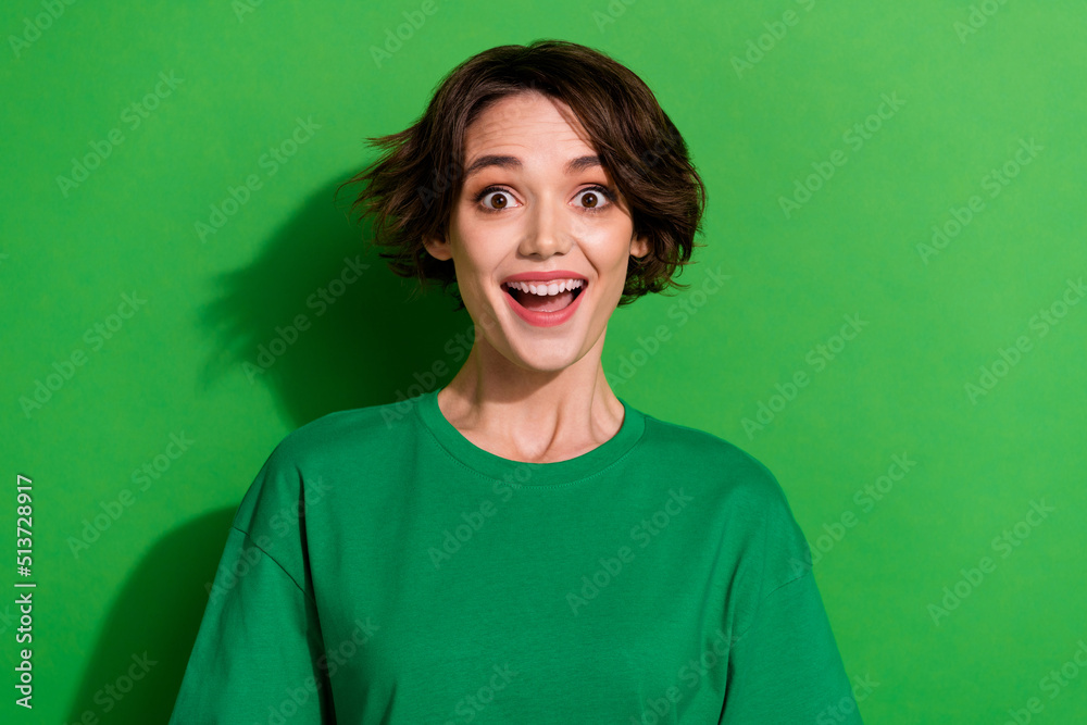 Photo of impressed cheerful girl tooth smile open mouth look camera isolated on green color background Photo of impressed cheerful girl tooth smile open mouth look camera isolated on green color background