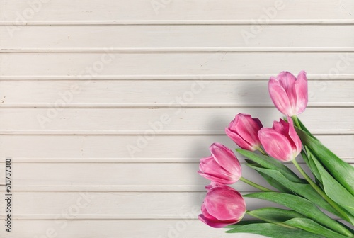 Fototapeta Naklejka Na Ścianę i Meble -  Colorful tulips bouquet on wooden desk