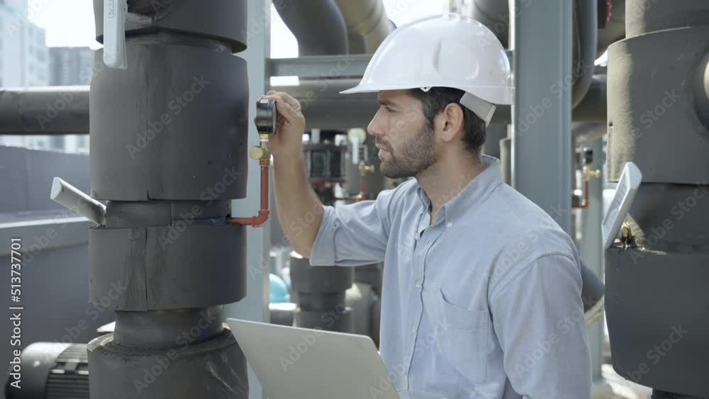 Technician working and inspecting the pipeline in factory Technician working and inspecting the pipeline in factory