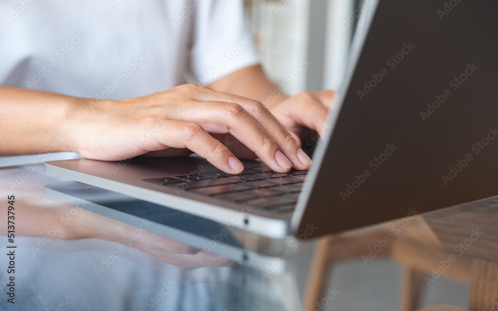 Closeup image of hands typing on laptop computer keyboard Closeup image of hands typing on laptop computer keyboard