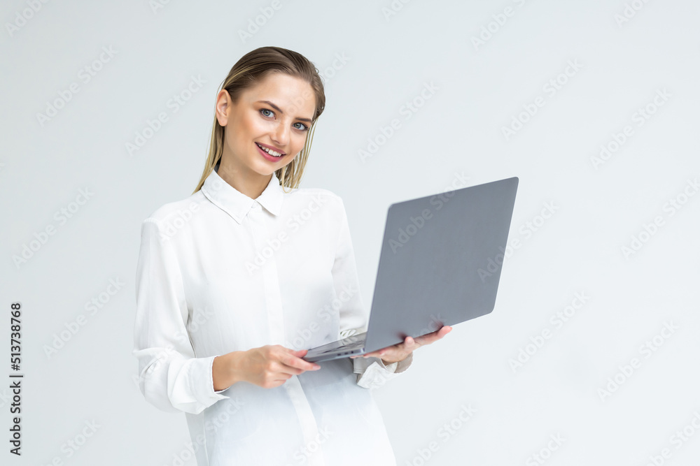 Portrait of a happy businesswoman working on laptop computer isolated over white background Portrait of a happy businesswoman working on laptop computer isolated over white background