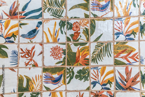 Tropical Hawaiin square ceramic porcelain tile on a wall for a colorful pattern photo