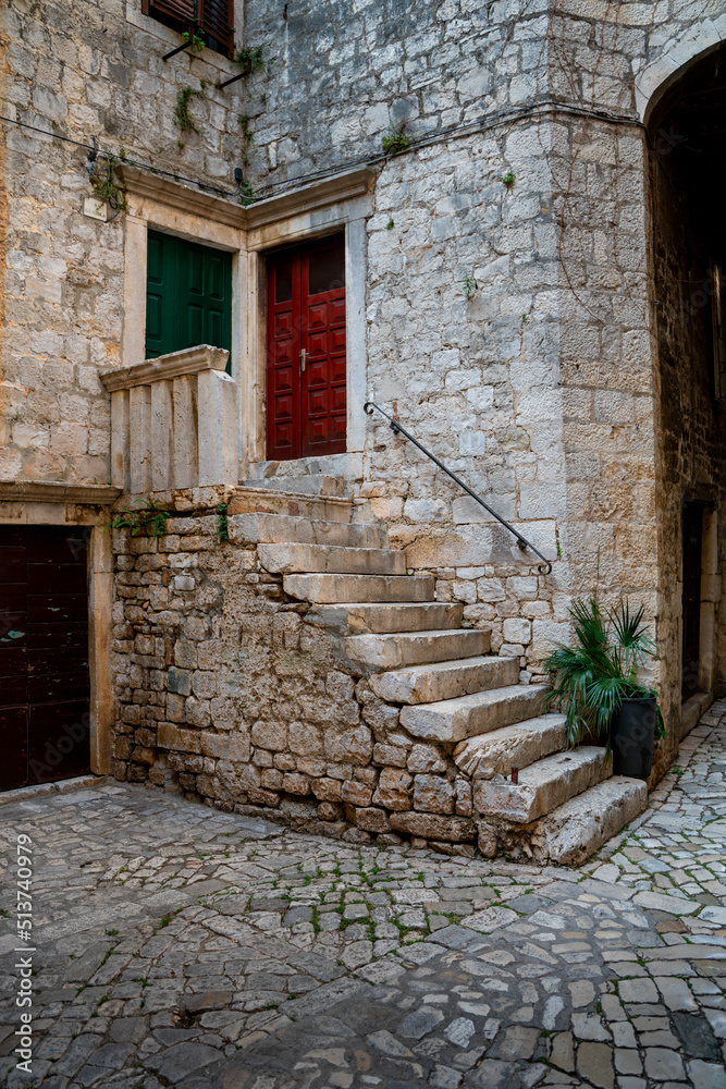 Empty morning streets in mediteranean historical city Trogir in Croatia