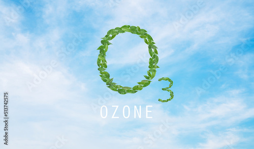 Ozone design with green leaves on blue sky background. photo