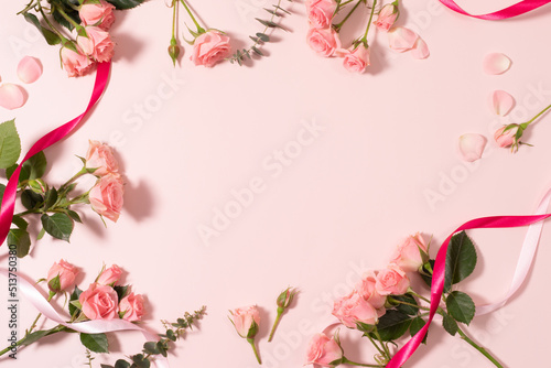 Valentines Day Heart Made of Pink Roses Isolated on Pink Background. © hugo