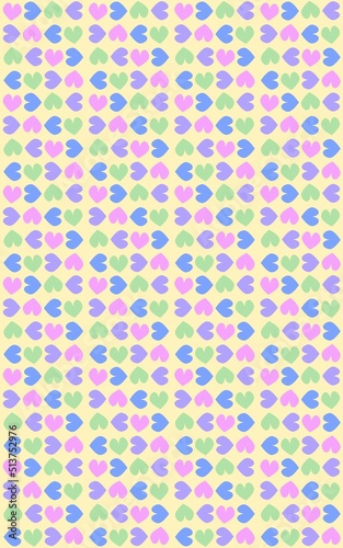 A light yellow background with colorful pink purple yellow blue hearts pattern