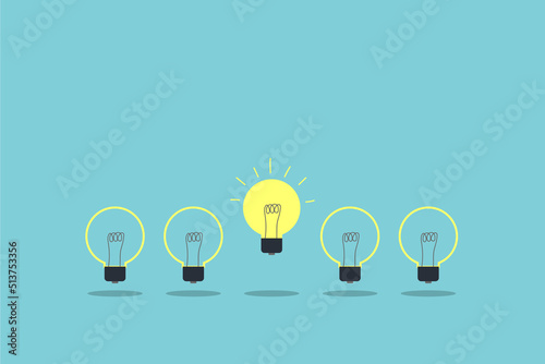 yellow light bulb standing out from the unlit incandescent bulbs. Individuality and different creative idea concepts. leadership