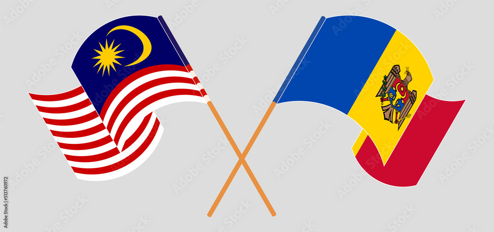 Crossed and waving flags of Malaysia and Moldova Crossed and waving flags of Malaysia and Moldova