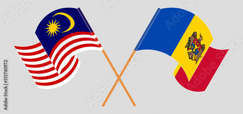Photography Crossed and waving flags of Malaysia and Moldova