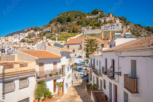 View of whitewashed houses and mountains in background, Frigiliana, Malaga Province, Andalucia