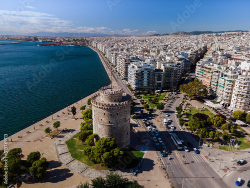 Aerial drone view of White Tower landmark with residential buildings at Leoforos Nikis, calm seafront, Thessaloniki, Greece photo