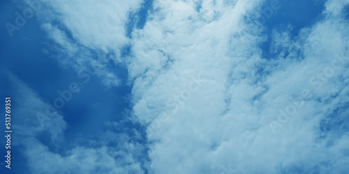 Abstract shinny and fresh summer sky background with clouds, cloudy natural blue sky background for creative design and wallpaper.