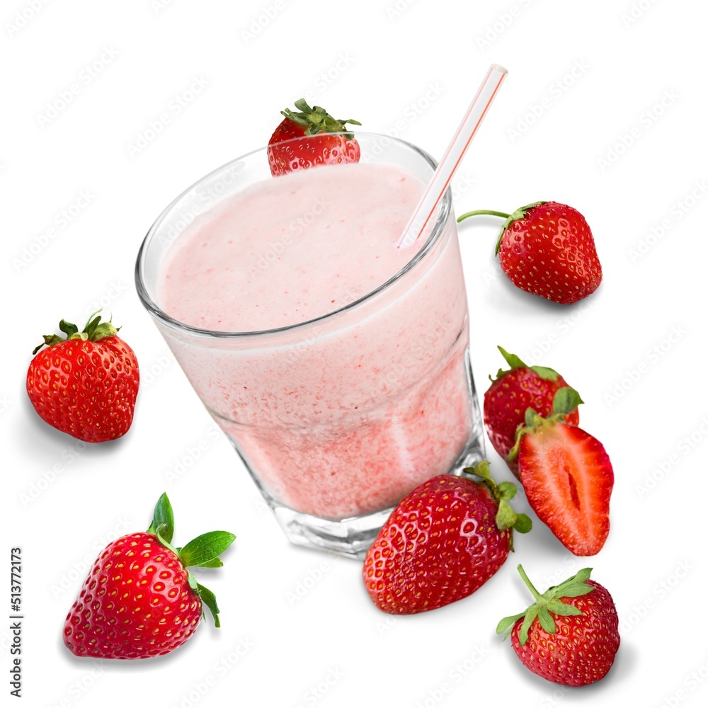 Glass of fresh strawberry milkshake or smoothie on white Glass of fresh strawberry milkshake or smoothie on white