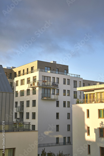 Sunset in a European middle house apartment. Concept of modern architecture for a better living. Contemporary medium-sized flat building in Europe