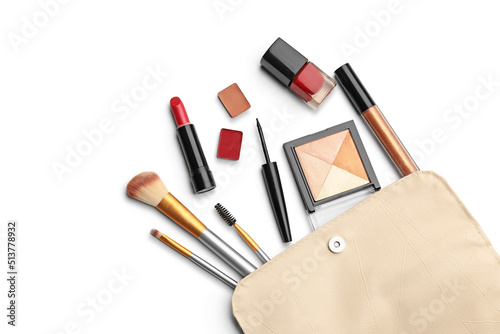 Make up products. Lipstick, powder, shadows with cosmetic bag. Image with copy space. White background with clipping path