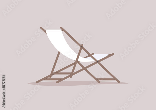 A deck chair made of wood and a piece of fabric, summertime outdoor lifestyle