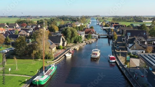 Aerial from boats cruising through the village Echtenerbrug in Friesland the Netherlands photo