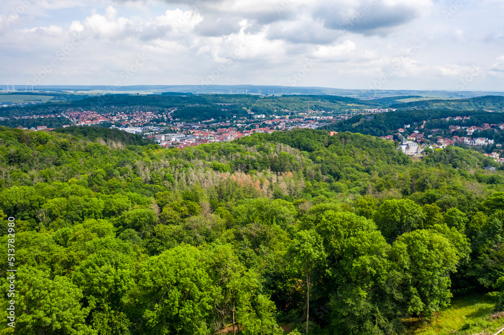 Aerial view of the skyline or citysccape of Eisenach with vast forest and green surrondings, Eisenach, Germany