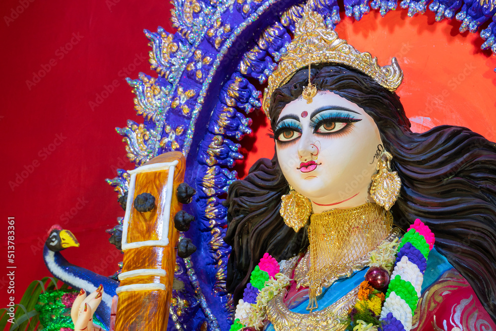 Face of Goddess Saraswati at Kolkata, West Bengal, India. Saraswati is Hindu goddess of knowledge, music, art, wisdom, and learning. Worshipping is done to get divine blessing to achieve excellence.