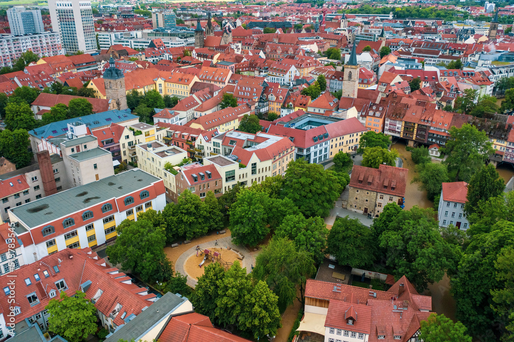 Aerial view of the historic center of Erfurt old city from above with old houses , bridge and churches