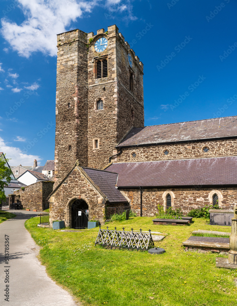 Solid stone tower and structure of St Mary Church and graveyard in the historic town of Conwy in Wales