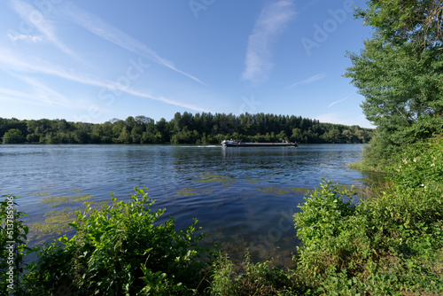 Barge on the Seine river near Saint-Fargeau-Ponthierry village in Ile-de-France region