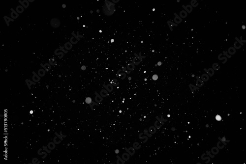 Snow background. Snow on a black background. Snowflakes for overlay.