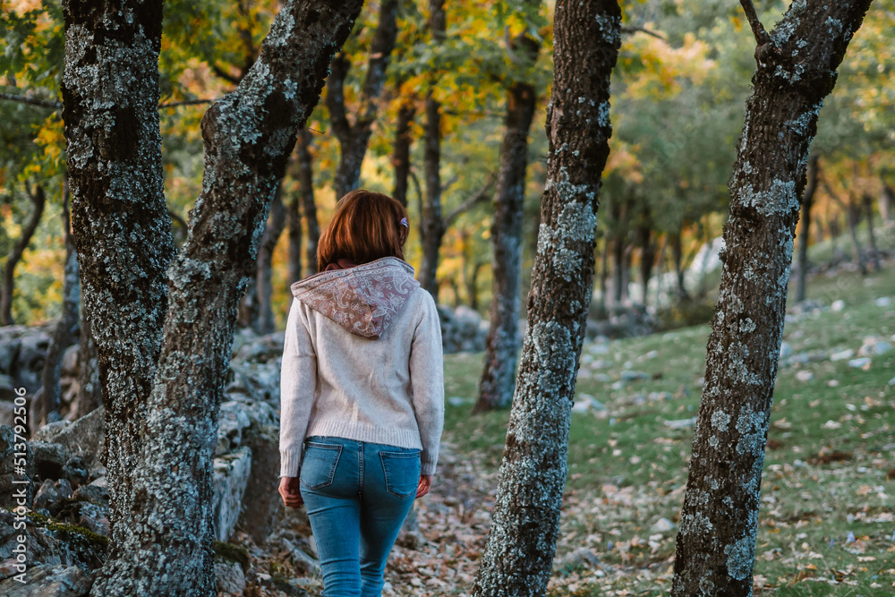 Young woman walkink in a beautiful autumn forest Young woman walkink in a beautiful autumn forest
