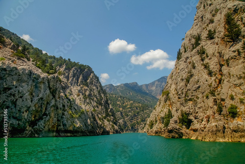 Fototapeta Naklejka Na Ścianę i Meble -  Summer landscape with mountains and lake Green Canyon (Turkey ). Tourism and beauty of Turkey nature. Beautiful mountain lake between rocks. Horizontal image.