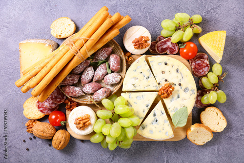 antipasto platter with blue cheese,  salami and breadsticks