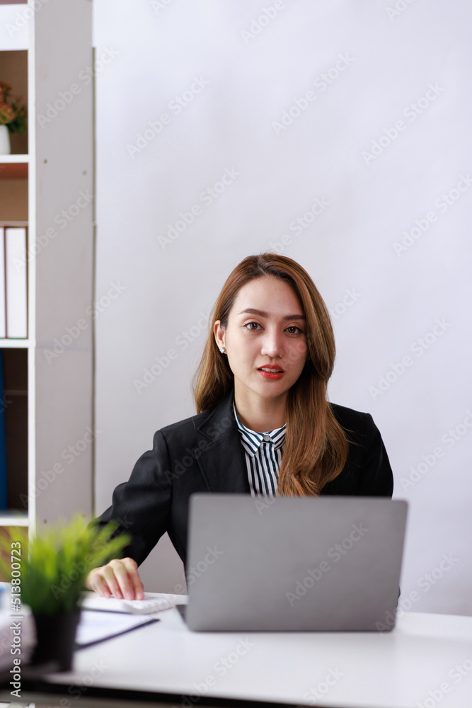 Modern Asian business woman in the home office, doing planning analyzing the financial report, business plan investment, finance analysis concept Modern Asian business woman in the home office, doing planning analyzing the financial report, business plan investment, finance analysis concept