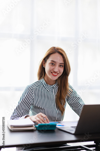 Modern Asian business woman in the home office, doing planning analyzing the financial report, business plan investment, finance analysis concept