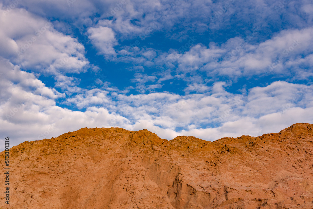 sandy mountain against the blue sky with clouds,beautiful landscape