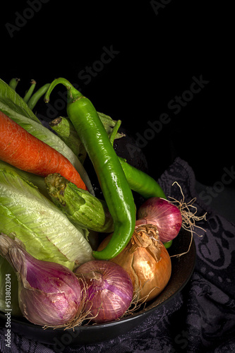 Assortment of fresh vegetables with dark background