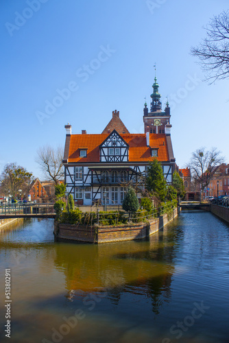 Picturesque scenery of half-timbered building on the river island near Great Mill (Dwor Mlynarzy) in Old Town of Gdansk, Poland 