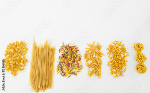 Assortment of shapes of pasta on white background isolated