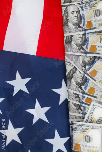 USA national flag and the dollar bills. Business and finance concept