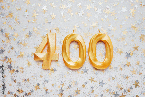 400 four hundred followers card golden birthday candle on Festive Background. Template for social networks, blogs. Social media celebration banner. 400 online community fans. four hundred subscriber photo