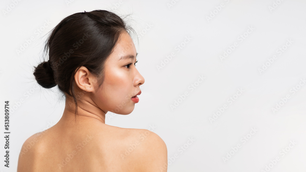 Naked korean lady posing on white studio background, back view of asian woman looking at copy space, panorama Naked korean lady posing on white studio background, back view of asian woman looking at copy space, panorama
