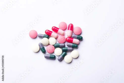 Pink vitamin tablets. Dietary supplements and pills for dieting. Medical concept. Flat lay