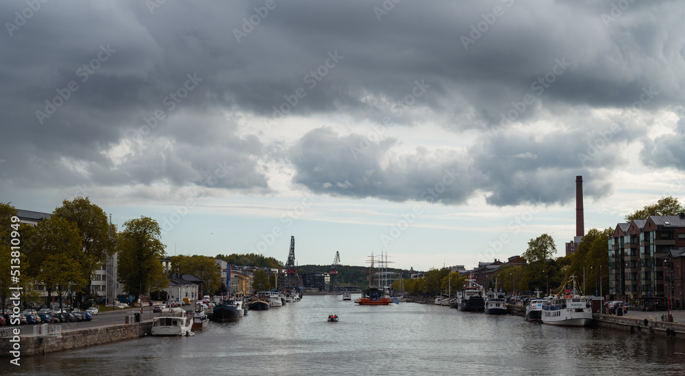 Panoramic shot of the river of under a stormy sky