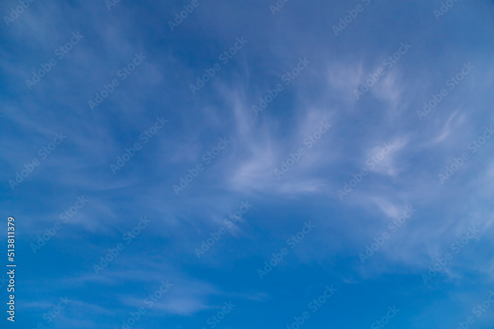 Blue sky cirrus clouds.