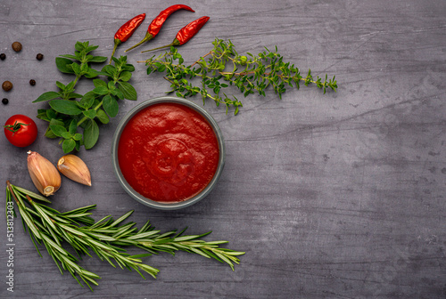 Food photography of passata, tomato sauce, ketchup, herbs