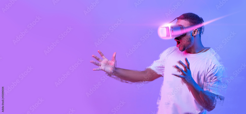 Excited African American Man Playing Video Game In VR Glasses