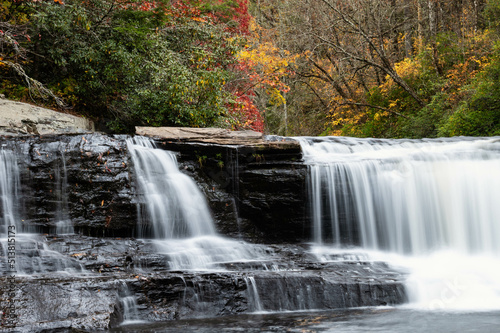 Fototapeta Naklejka Na Ścianę i Meble -  Refreshing Waterfall Hidden Deep in the Autumn Forest