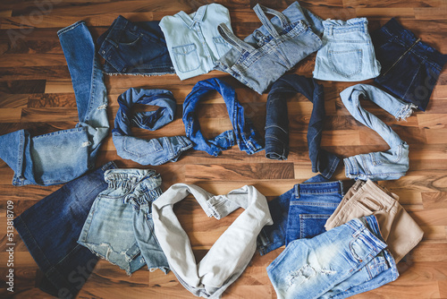 The word jeans made from different denim clothes. Fashion style background. Denim daze. Shopping concept.